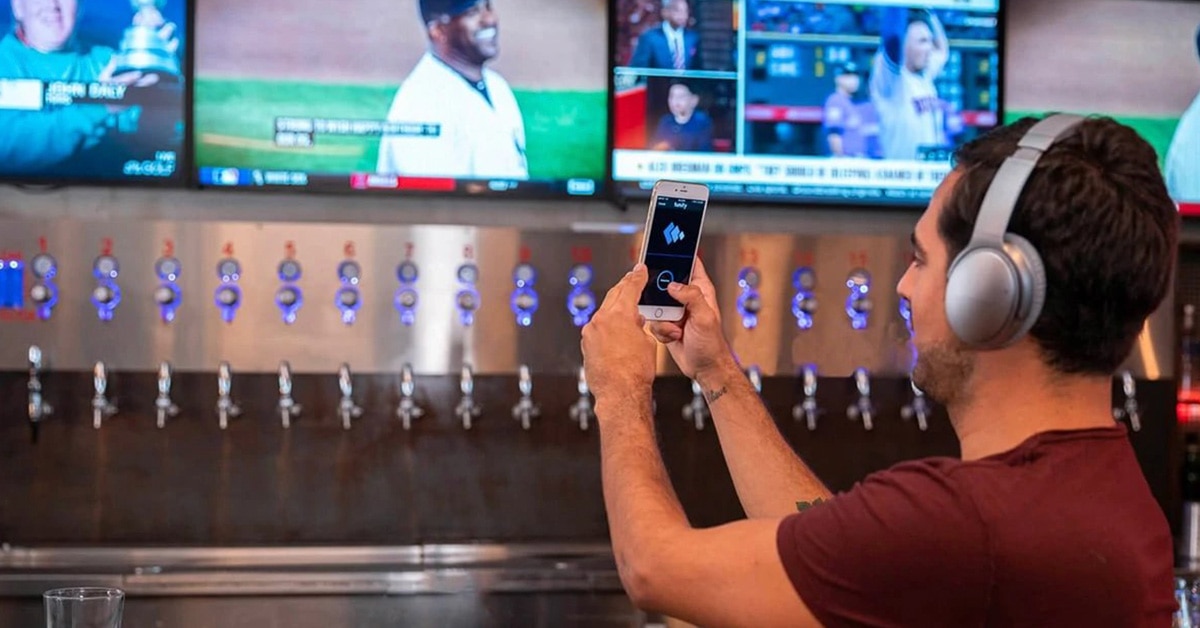 How to listen to muted TVs in bars and at the gym using your phone